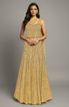 A gold corset lehenga set with intricate silver embroidery and a one-shoulder drape.