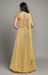 Gold crystal hand-embroidered corset lehenga set with a flowing skirt and draped dupatta.