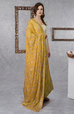 On Her: Mango Mojito Gota Patti & Zari Anarkali Set | On Him: Sunglow Yellow Pintuck Kurta & Mustard Waistcoat Jacket Set