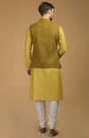 On Her: Mango Mojito Gota Patti & Zari Anarkali Set | On Him: Sunglow Yellow Pintuck Kurta & Mustard Waistcoat Jacket Set