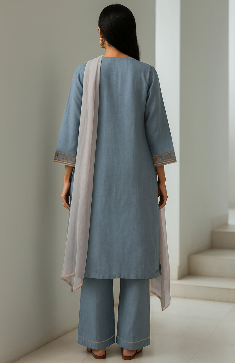 Powdered indigo embroidered kurta set with wide-leg trousers and a sheer dupatta.