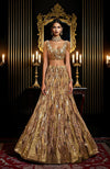 A gold hand-embroidered lehenga set with a cape.