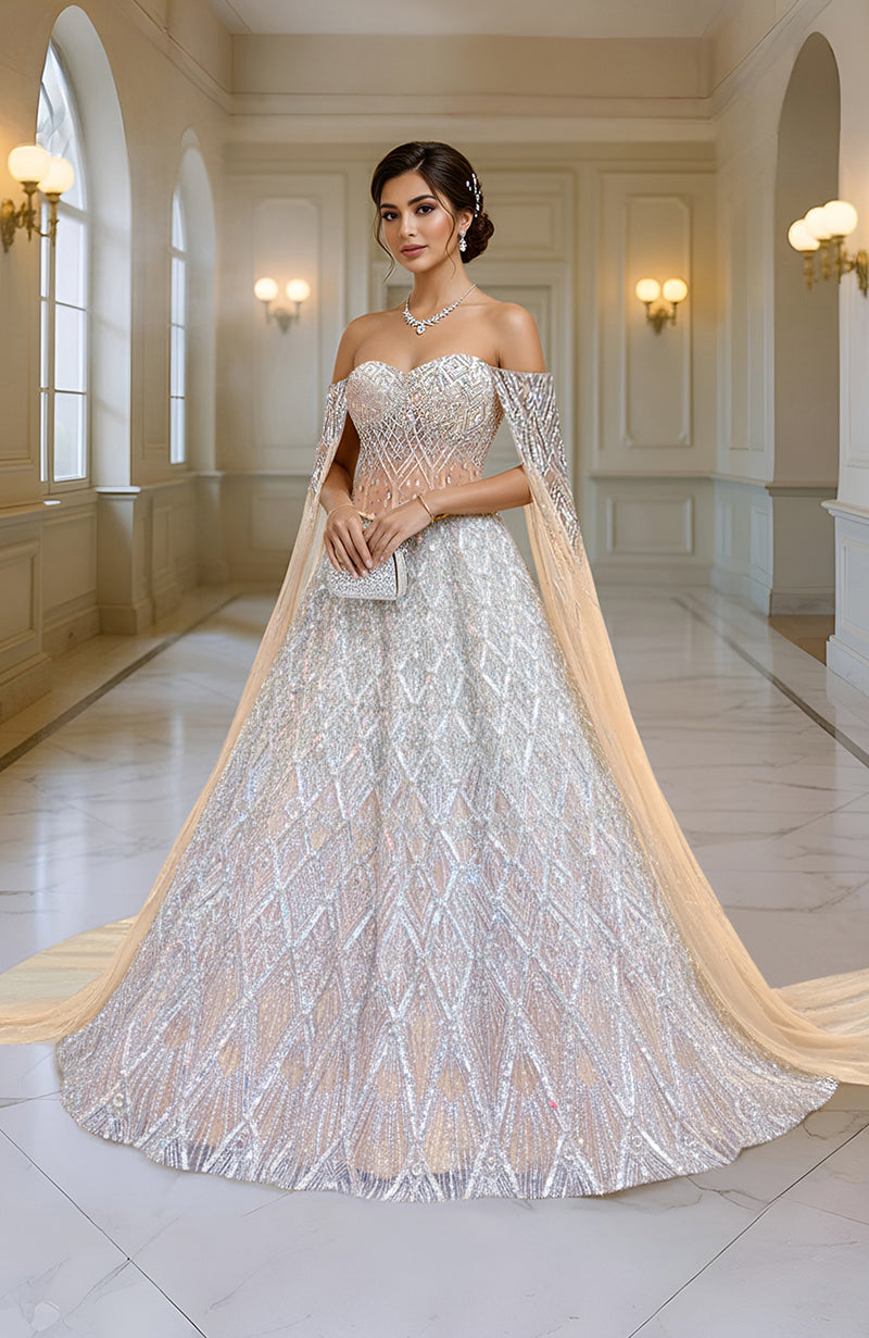 Silver champagne hand-embroidered lehenga set with cape sleeves.