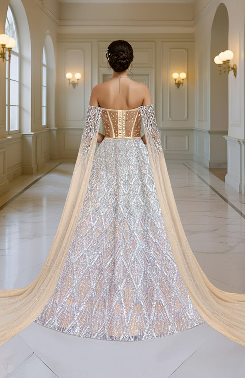 Silver champagne hand-embroidered lehenga set with cape sleeves.