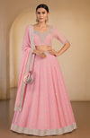 A pink lehenga set with gota patti and zardozi embroidery.