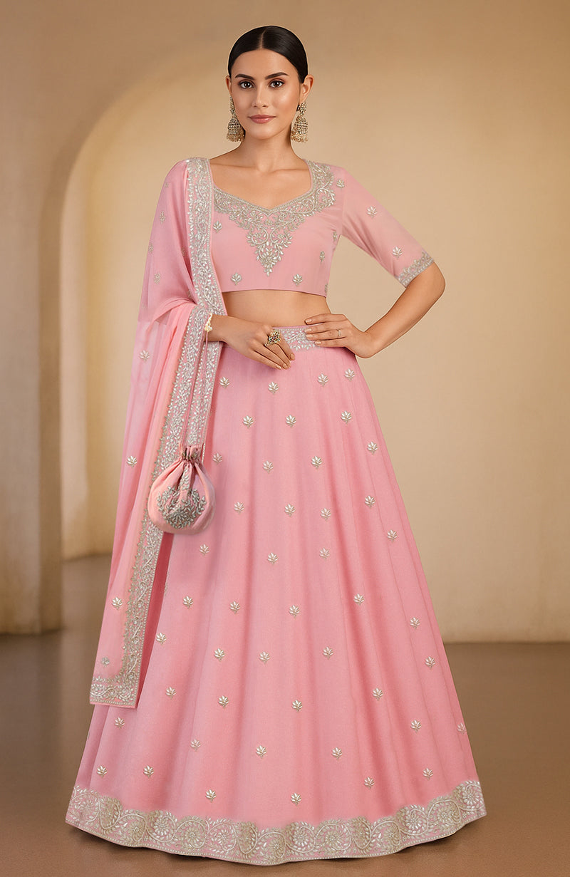 A pink lehenga set with gota patti and zardozi embroidery.