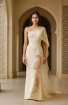 One-shoulder ivory gown with embroidered paisley motif.