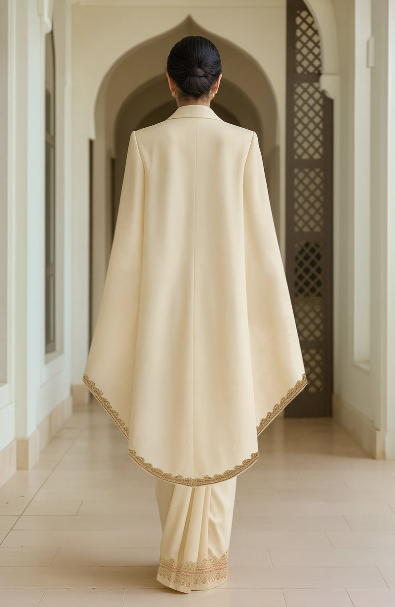 Ivory pre-draped saree with an embroidered cape.