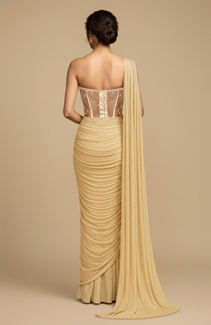 Champagne gold draped saree with crystal corset blouse.
