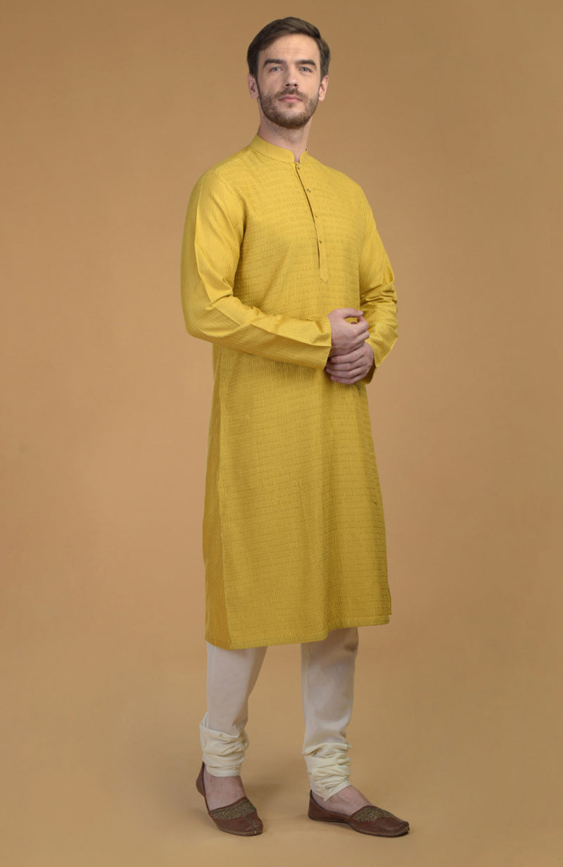 On Her: Mango Mojito Gota Patti & Zari Anarkali Set | On Him: Sunglow Yellow Pintuck Kurta & Mustard Waistcoat Jacket Set