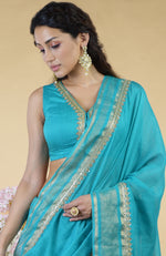 Teal Blue Hand Embroidered Linen Saree