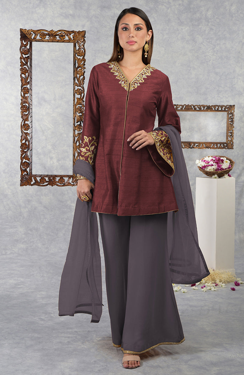 On Her: Pomegranate-Mulled Grape Raw Silk Hand Embroidered Jacket Set With Dupatta | On Him: Maroon Silk Velvet Sherwani Set